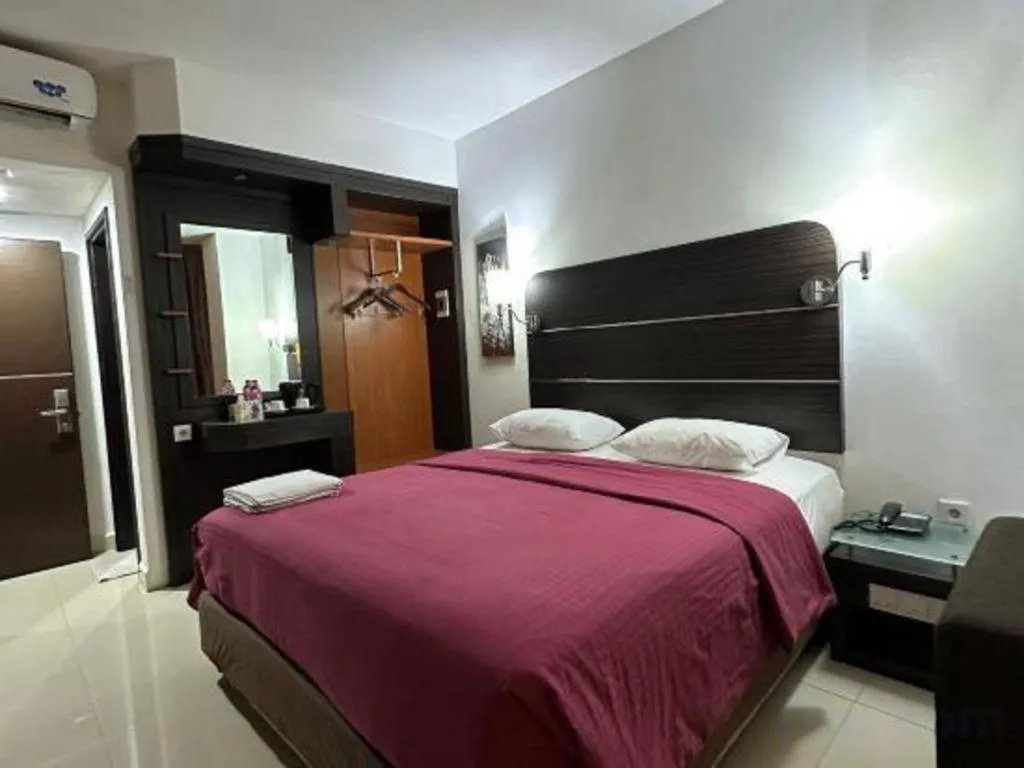 Bed in Travello Hotel Manado