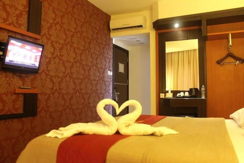 Bed in Travello Hotel Manado