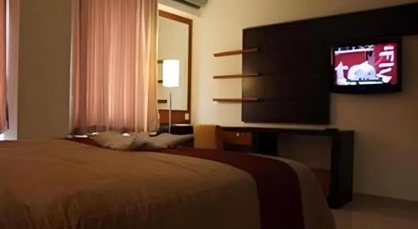 Bed in Travello Hotel Manado