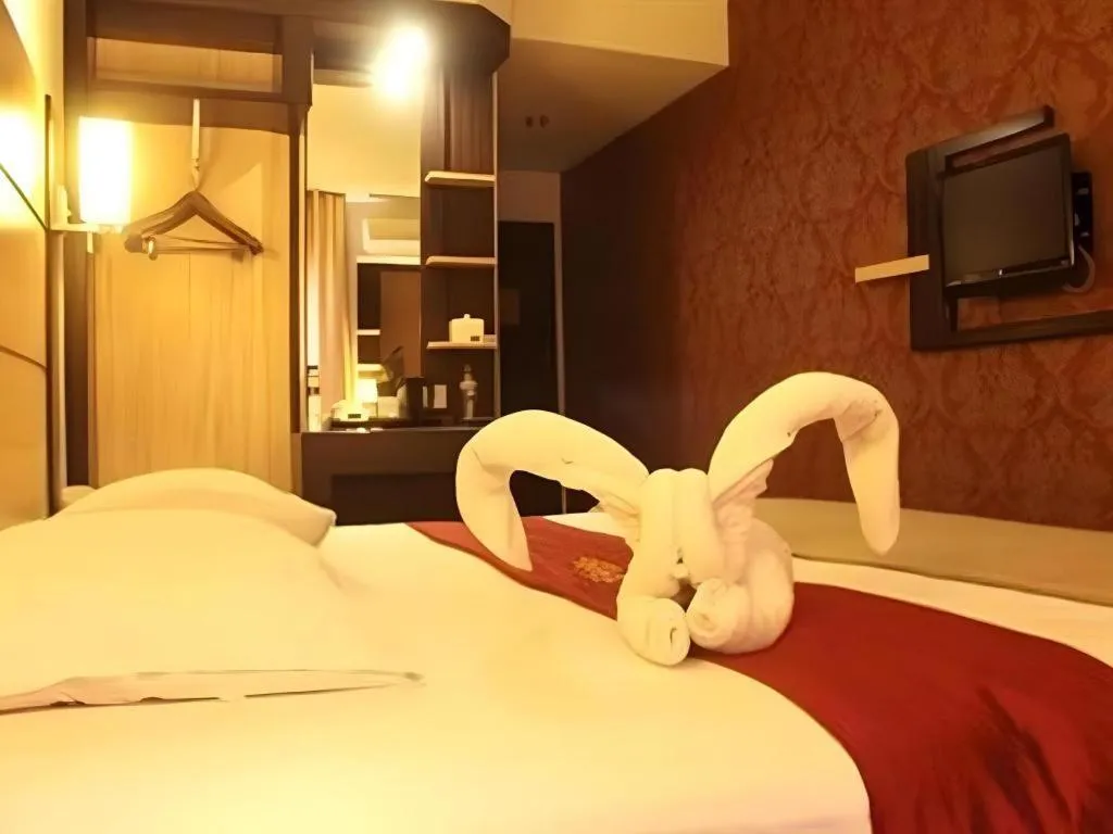 Bed in Travello Hotel Manado