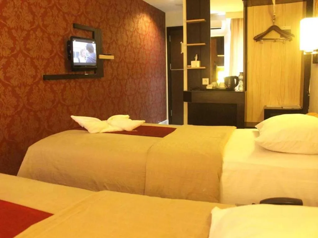 Bed in Travello Hotel Manado