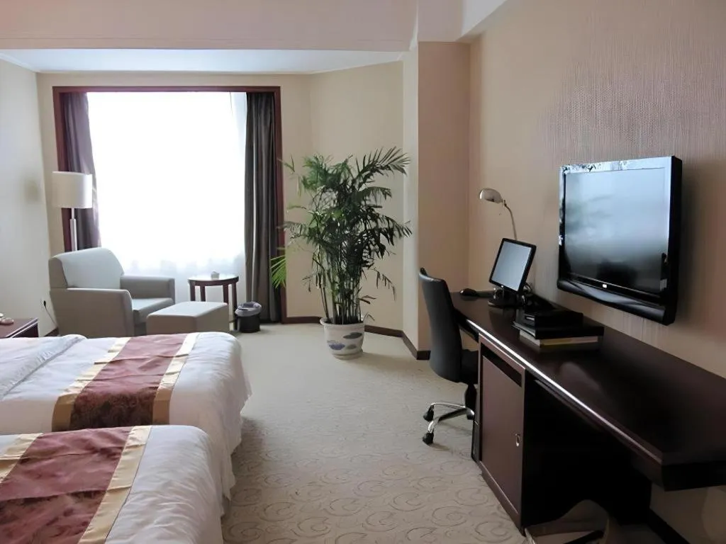 Bed in Fujian Galaxy Garden Hotel