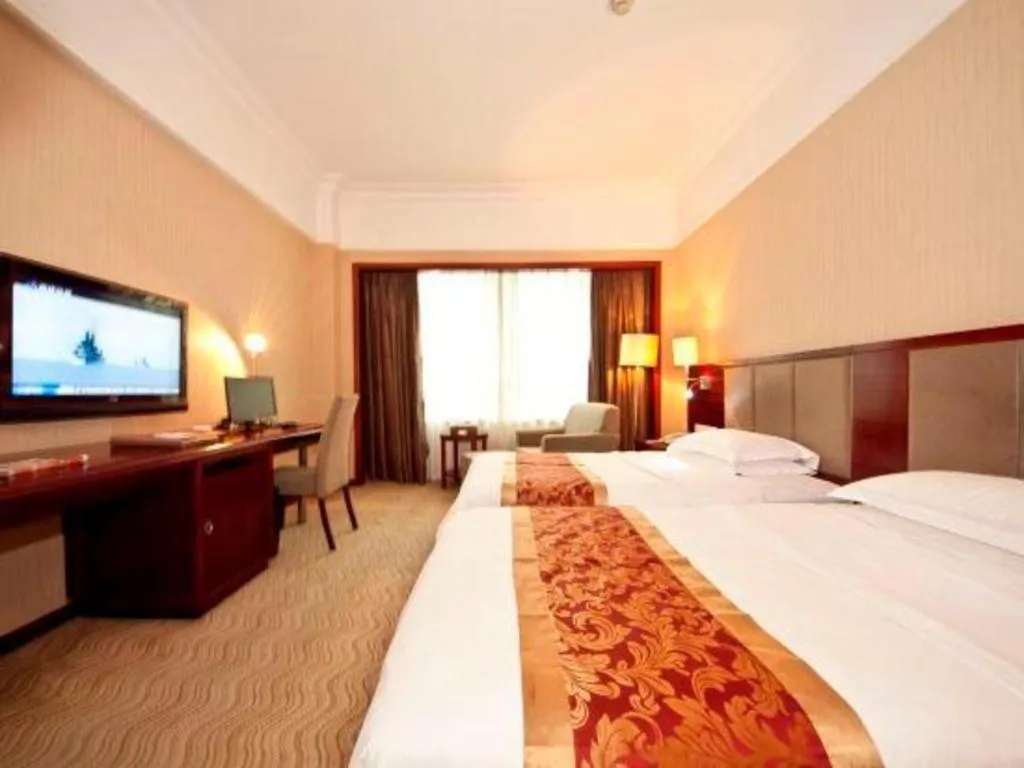 Bed in Fujian Galaxy Garden Hotel