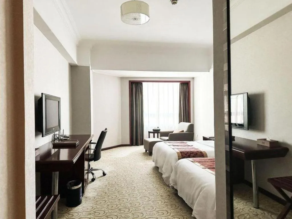 Bed in Fujian Galaxy Garden Hotel