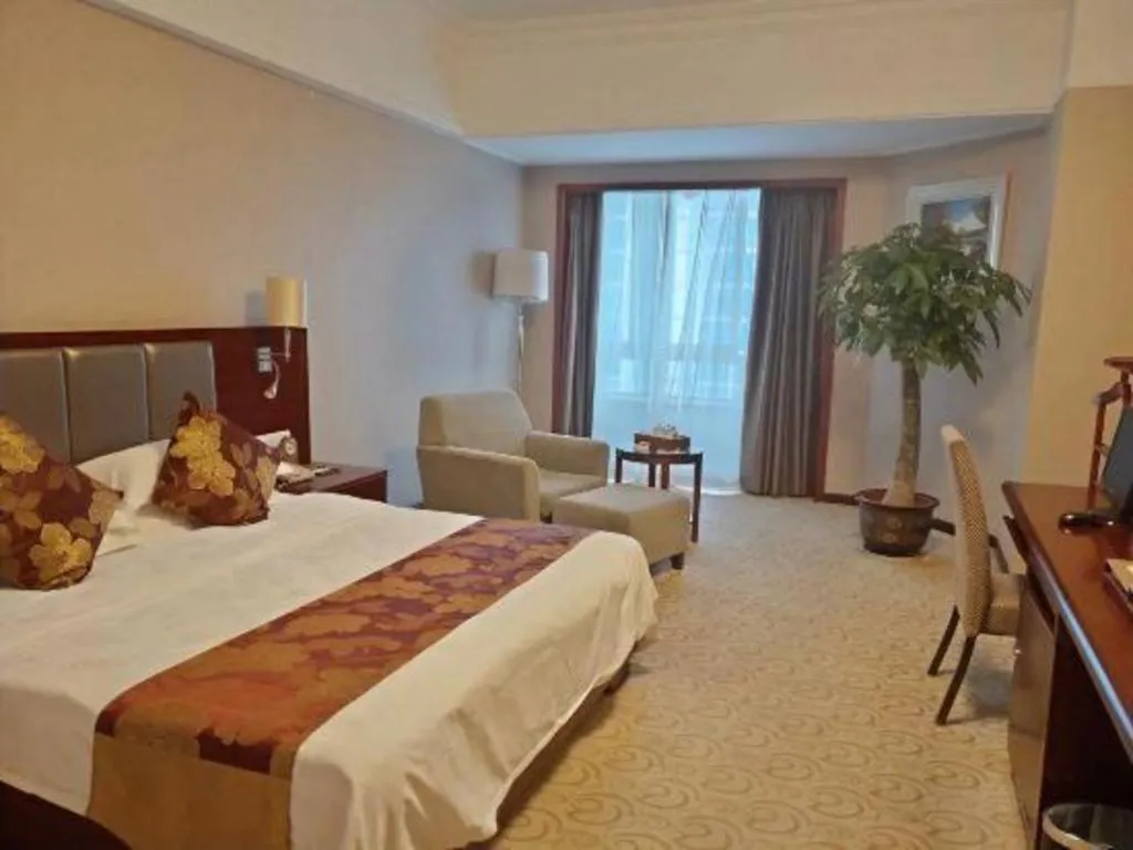 Bed in Fujian Galaxy Garden Hotel