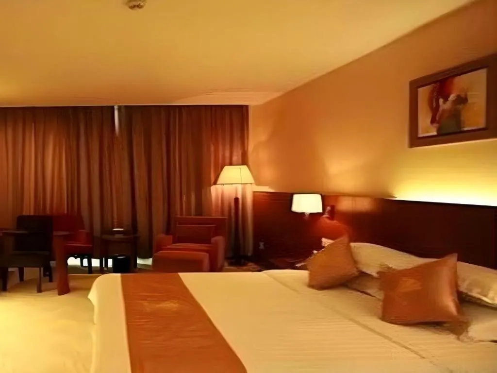 Bed in Fujian Galaxy Garden Hotel
