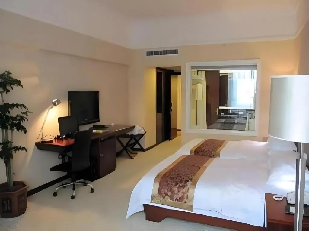 Bed in Fujian Galaxy Garden Hotel