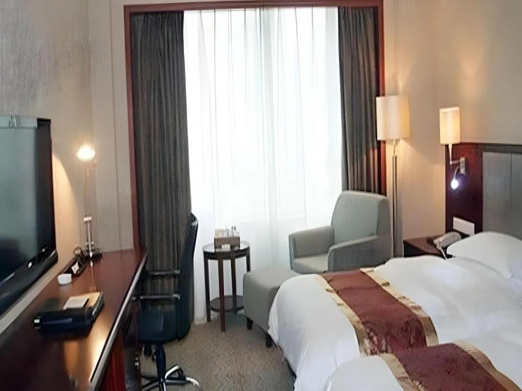 Bed in Fujian Galaxy Garden Hotel