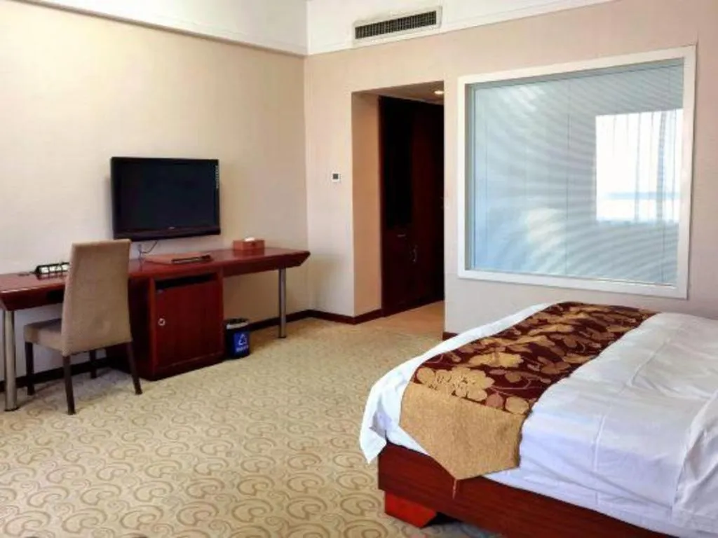 Bed in Fujian Galaxy Garden Hotel