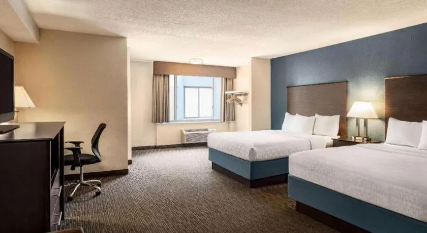 Bed in AmericInn by Wyndham La Crosse Riverfront-Conference Center