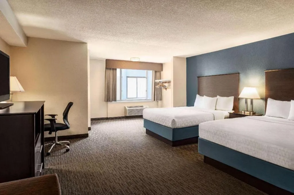 Bed in AmericInn by Wyndham La Crosse Riverfront-Conference Center