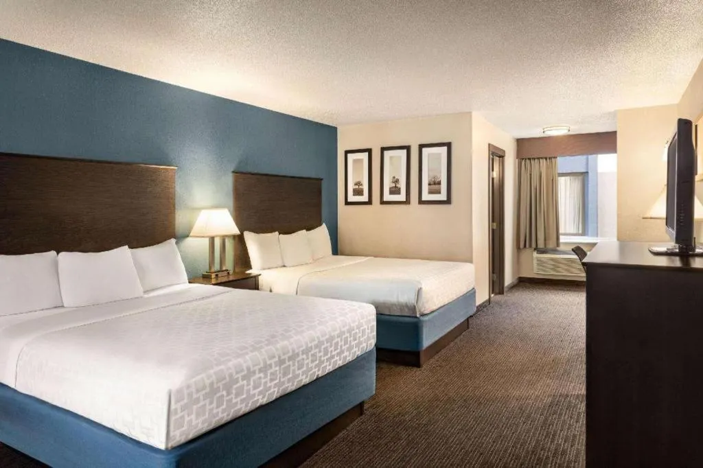 Bed in AmericInn by Wyndham La Crosse Riverfront-Conference Center