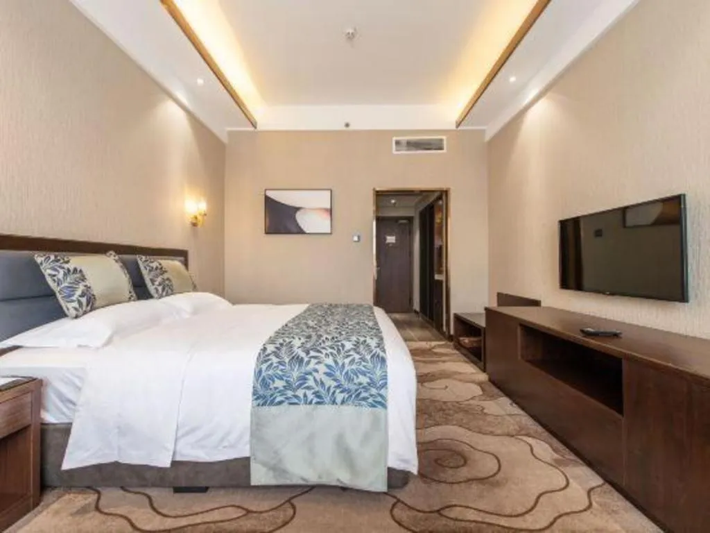 Bed in Dandong Rising Zhonglian Hotel