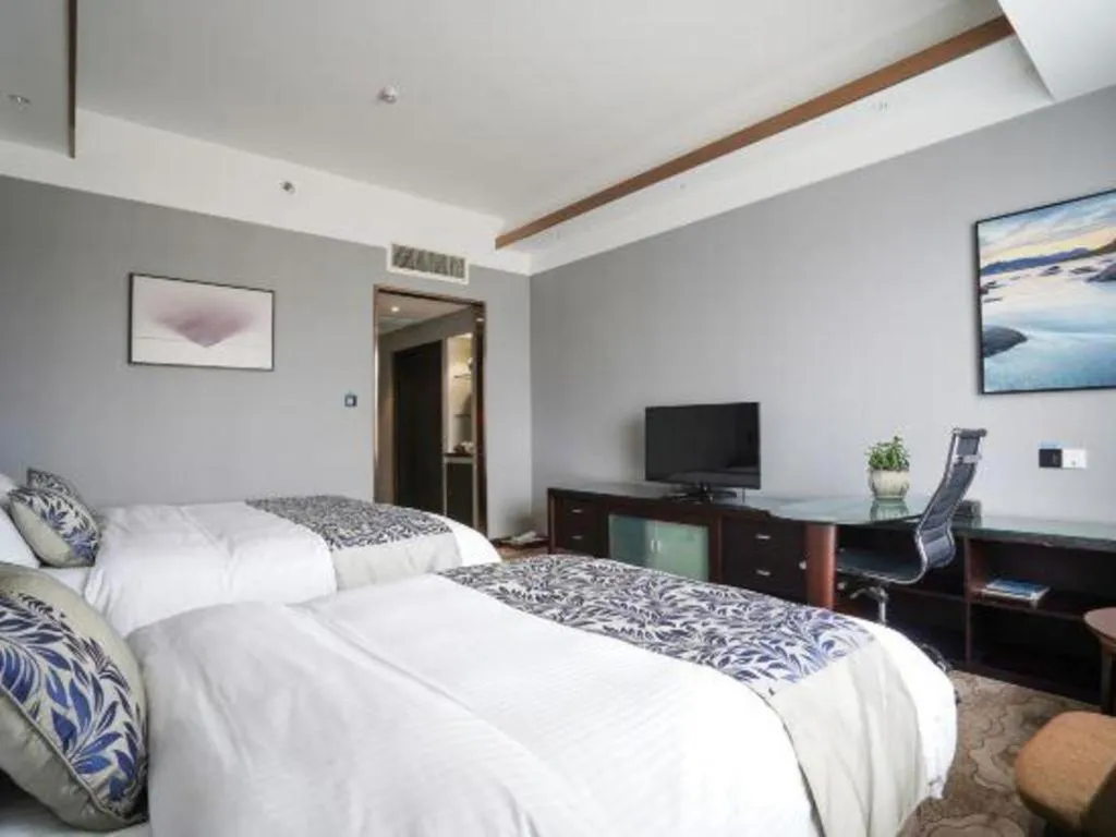 Bed in Dandong Rising Zhonglian Hotel