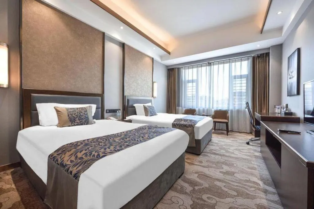 Bed in Dandong Rising Zhonglian Hotel
