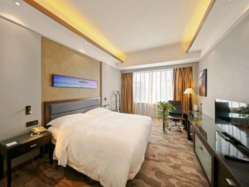 Bed in Dandong Rising Zhonglian Hotel