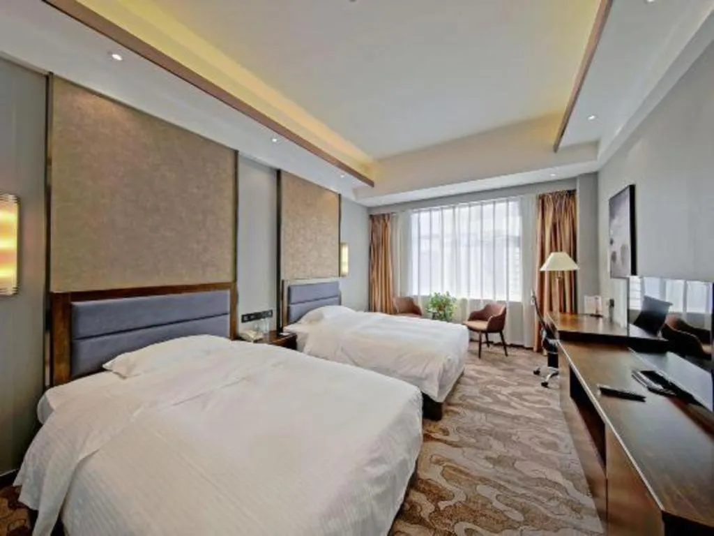 Bed in Dandong Rising Zhonglian Hotel