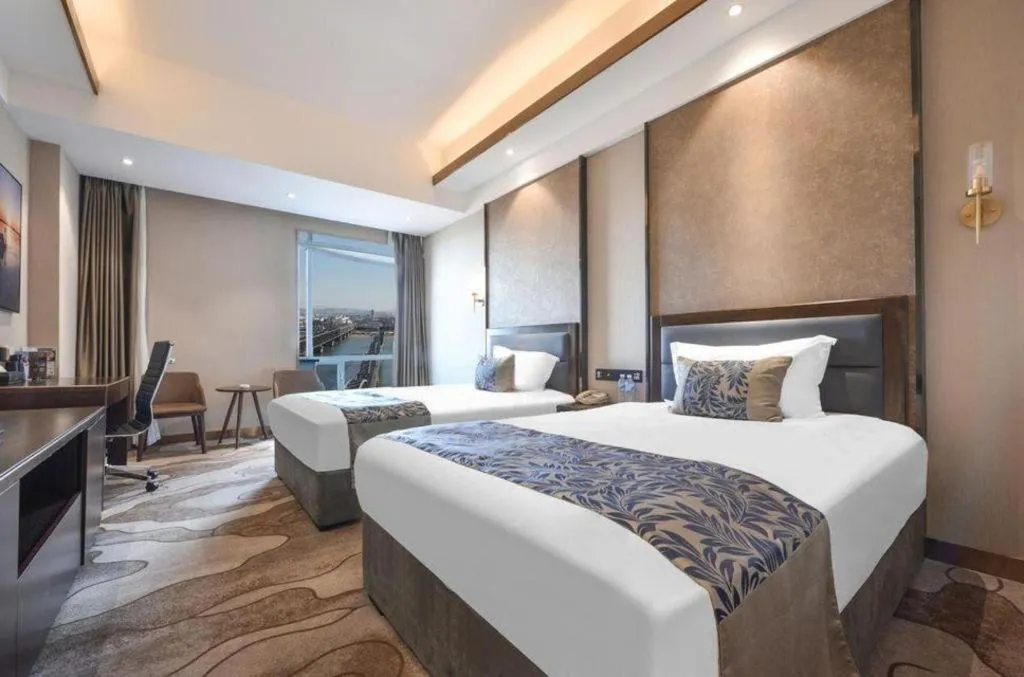 Bed in Dandong Rising Zhonglian Hotel