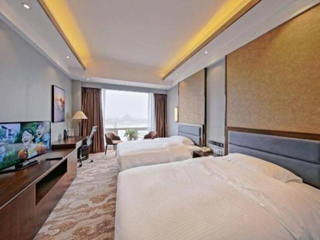 Bed in Dandong Rising Zhonglian Hotel