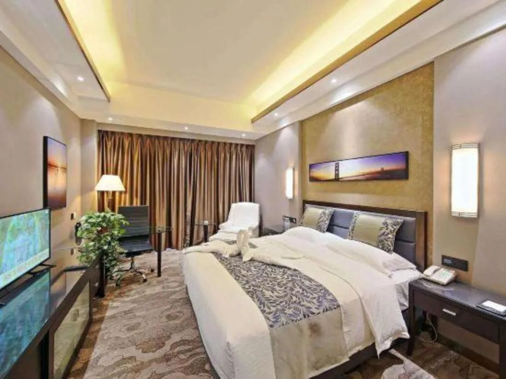 Bed in Dandong Rising Zhonglian Hotel