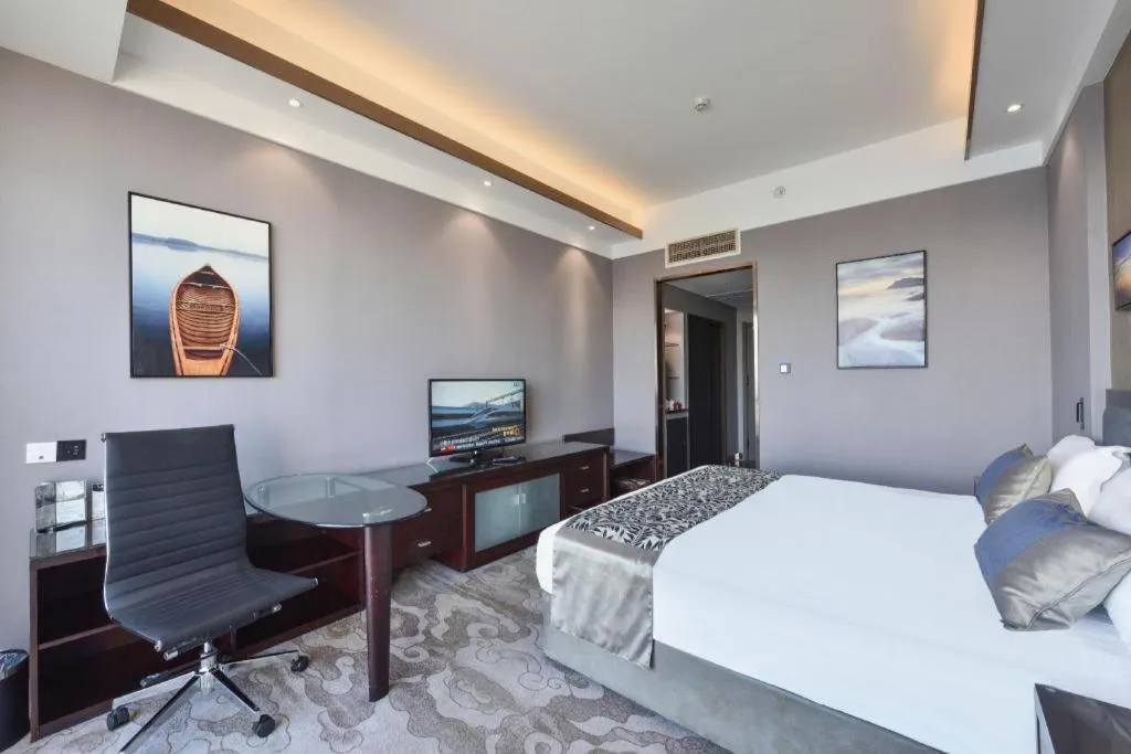 Bed in Dandong Rising Zhonglian Hotel