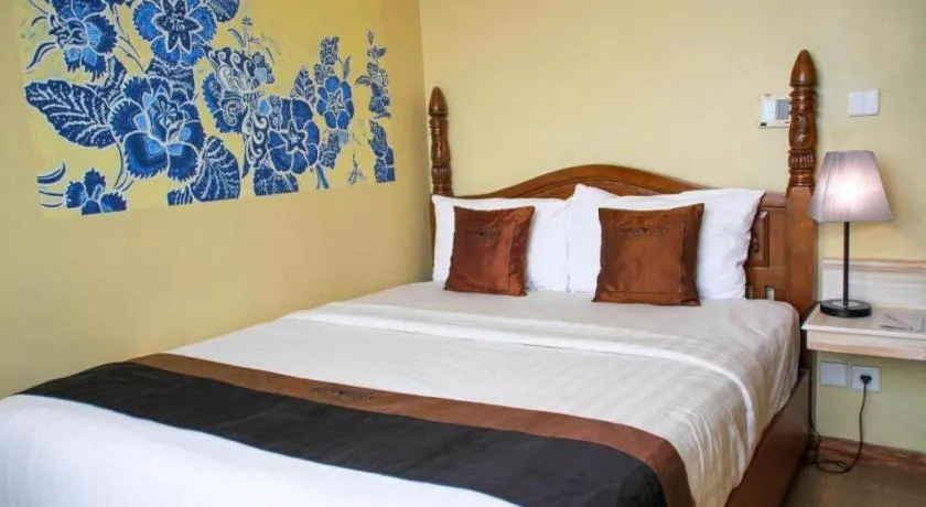 Bed in Amos Cozy Hotel Melawai