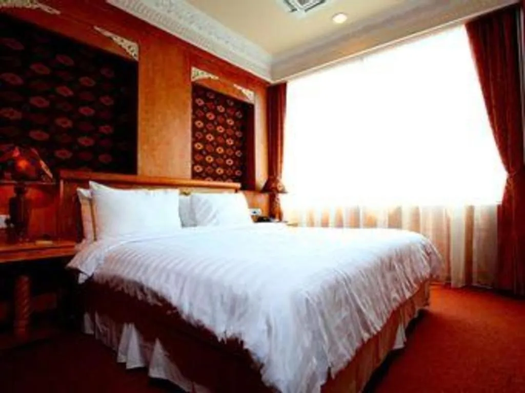 Bed in Amos Cozy Hotel Melawai
