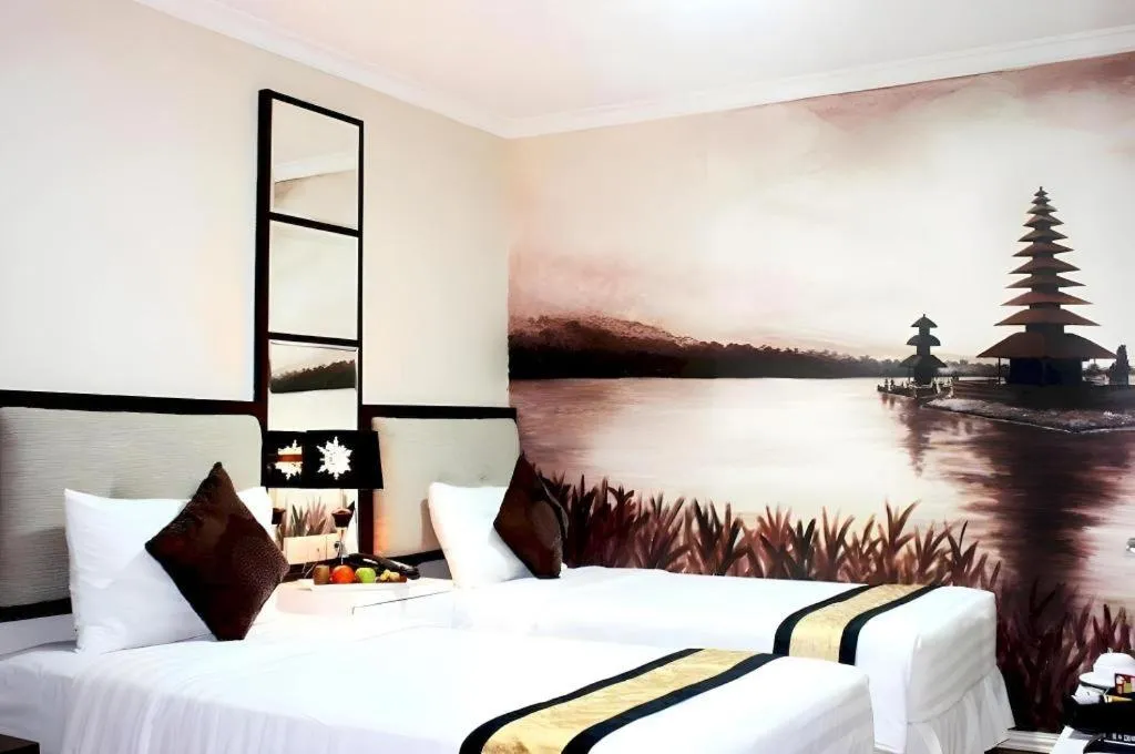 Bed in Amos Cozy Hotel Melawai