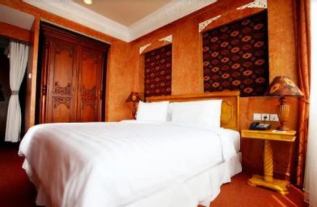 Bed in Amos Cozy Hotel Melawai