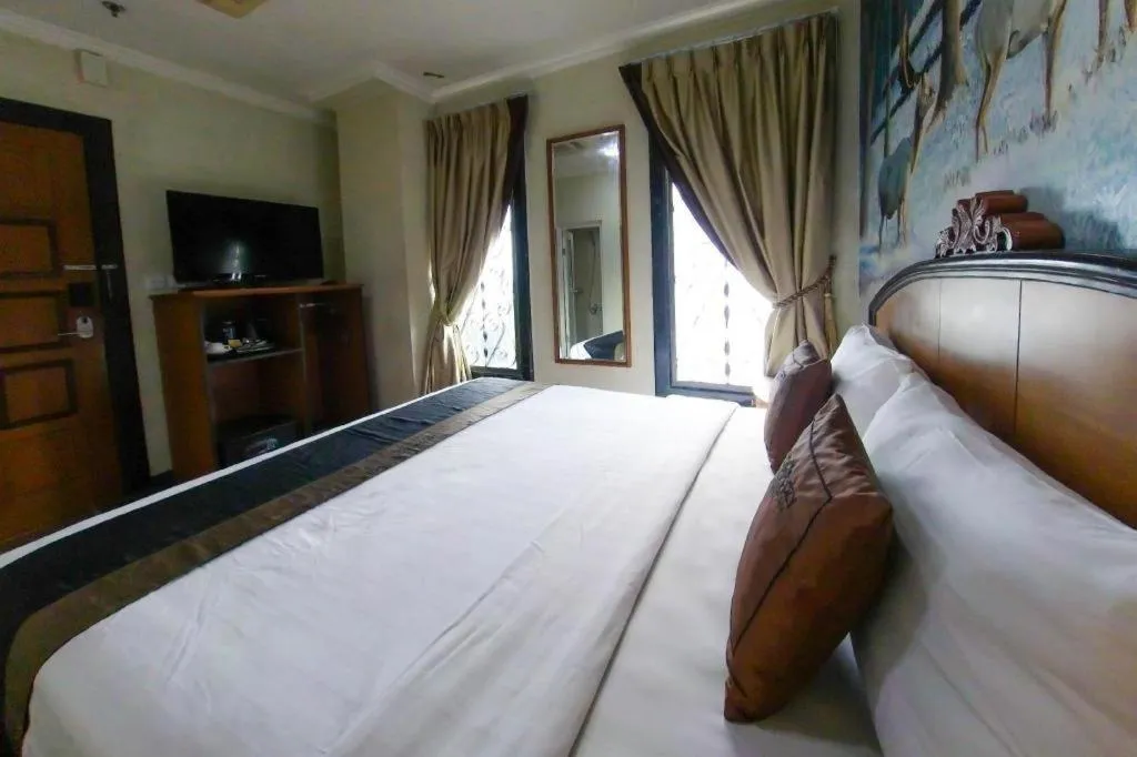 Bed in Amos Cozy Hotel Melawai
