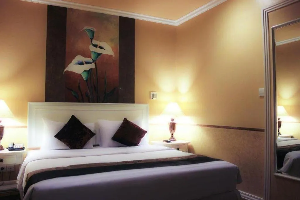 Bed in Amos Cozy Hotel Melawai