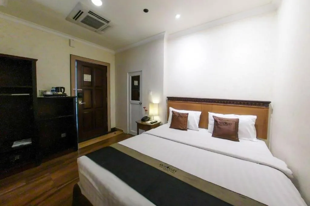 Bed in Amos Cozy Hotel Melawai