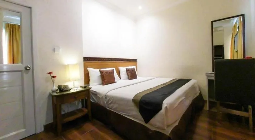 Bed in Amos Cozy Hotel Melawai