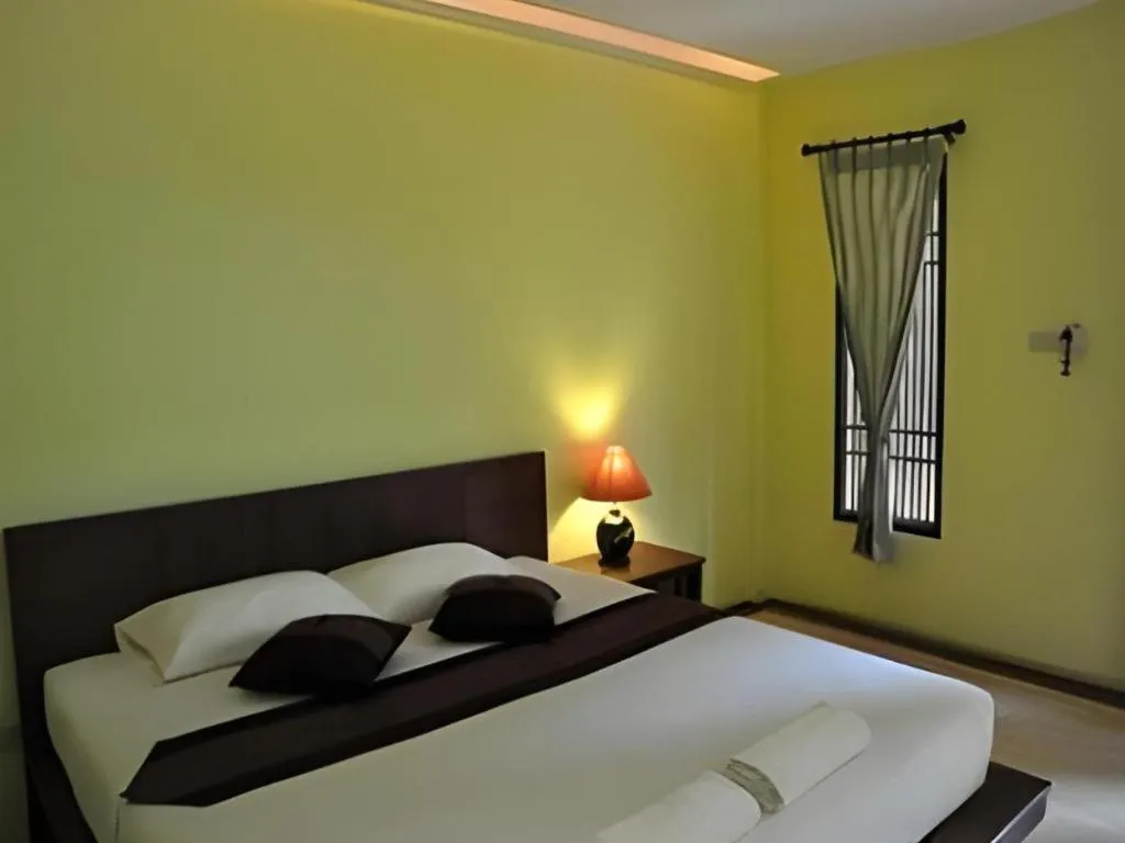 Bed in Baan Lapoon Hotel