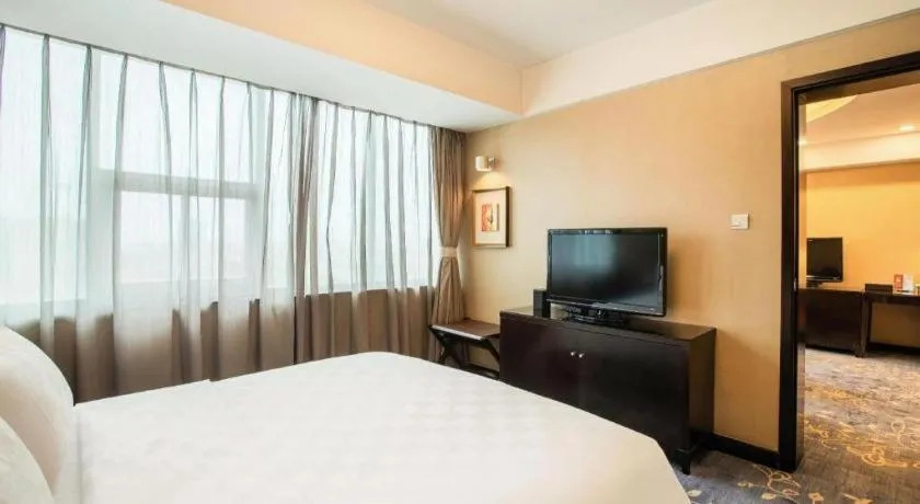 Bed in Zibo Blue Horizon International Hotel