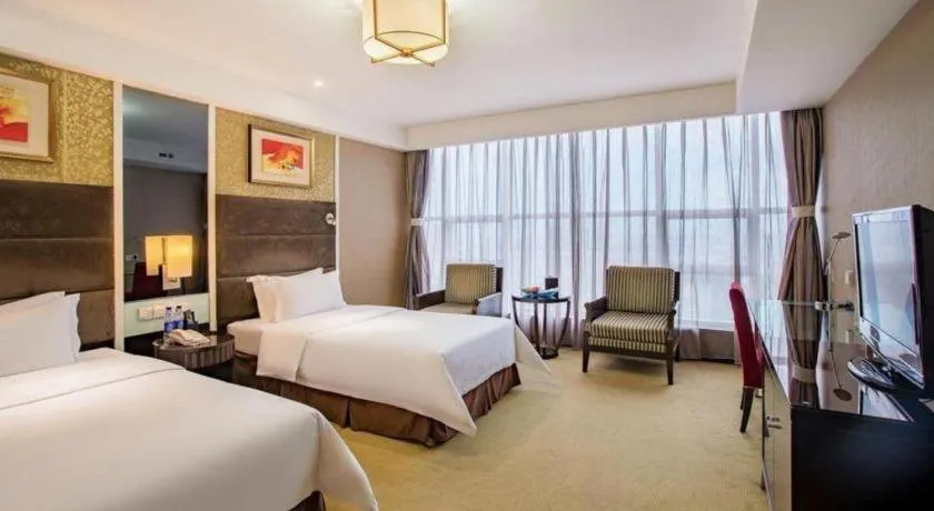 Bed in Zibo Blue Horizon International Hotel