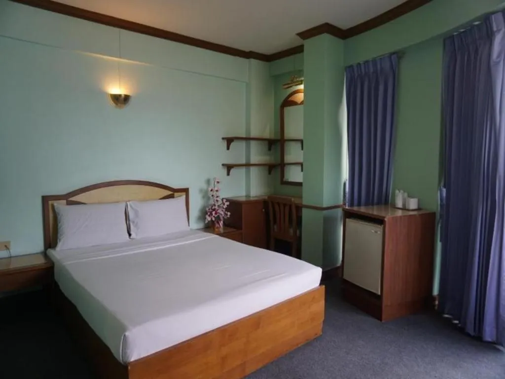 Bed in Tanaphat Hatyai Hotel