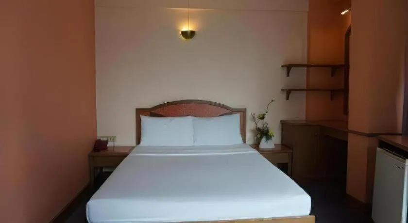 Bed in Tanaphat Hatyai Hotel