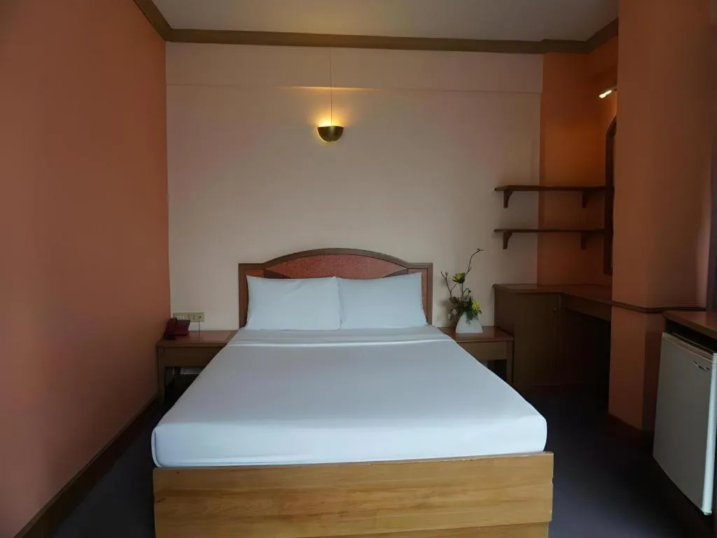 Bed in Tanaphat Hatyai Hotel