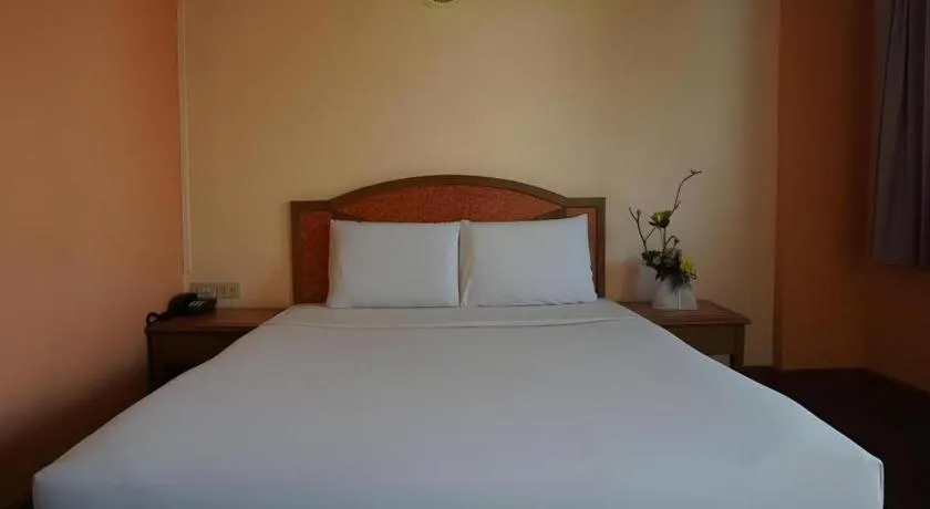 Bed in Tanaphat Hatyai Hotel