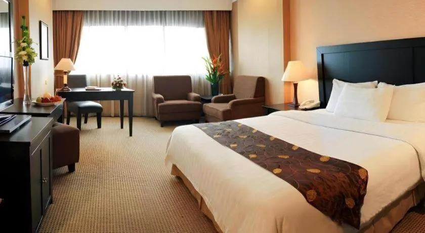 Bed in Danau Toba Hotel International