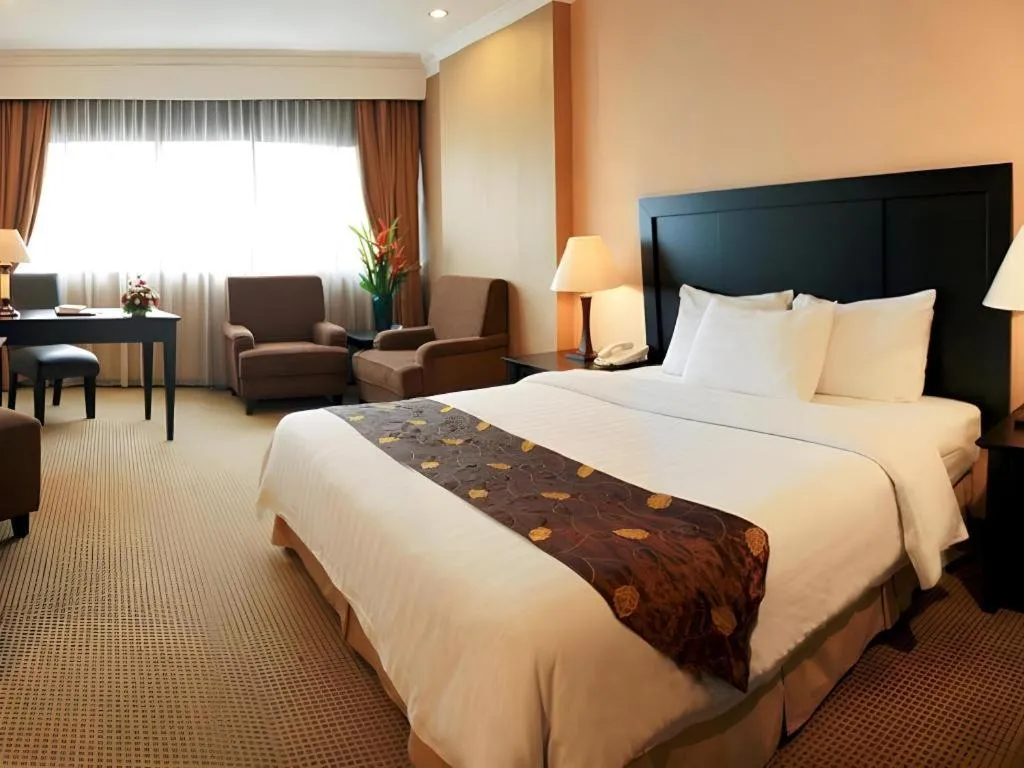 Bed in Danau Toba Hotel International