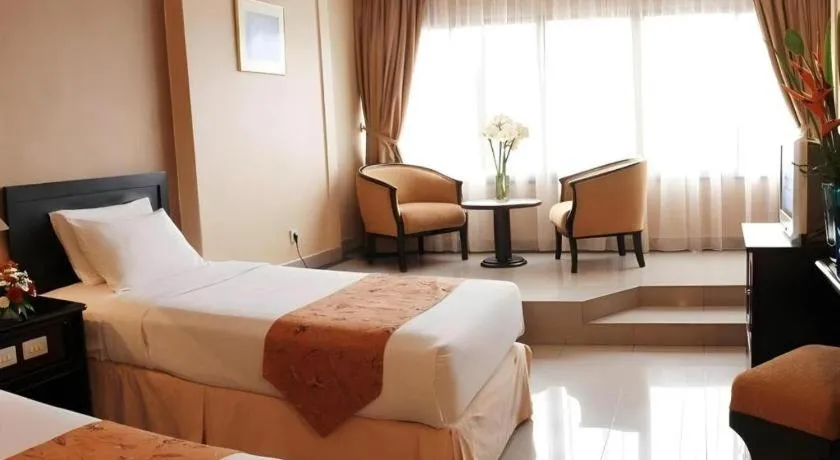 Bed in Danau Toba Hotel International