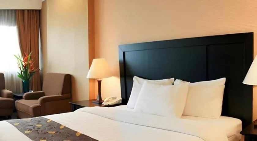 Bed in Danau Toba Hotel International