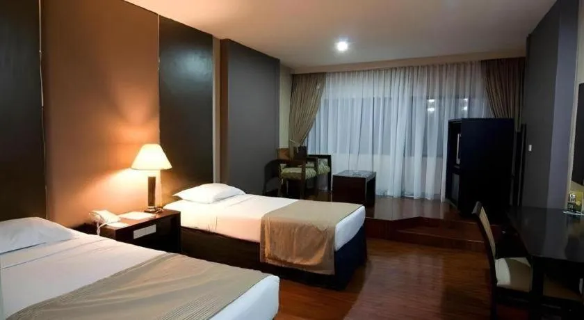 Bed in Danau Toba Hotel International