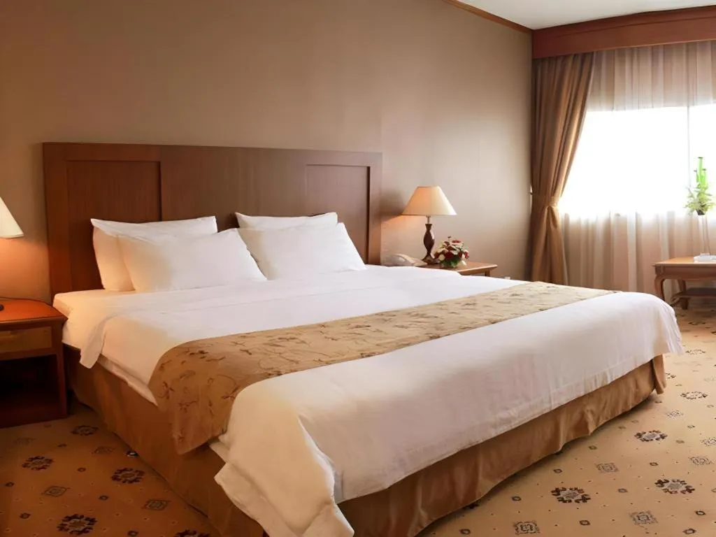 Bed in Danau Toba Hotel International