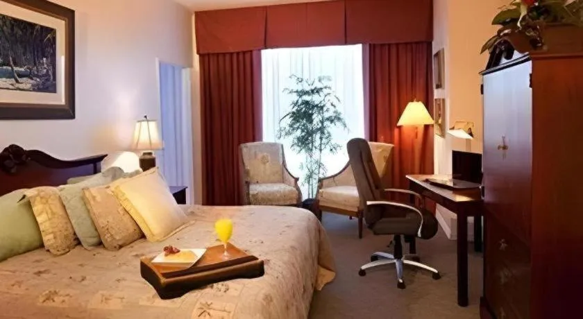 Bed in Magnuson Grand Conference Hotel