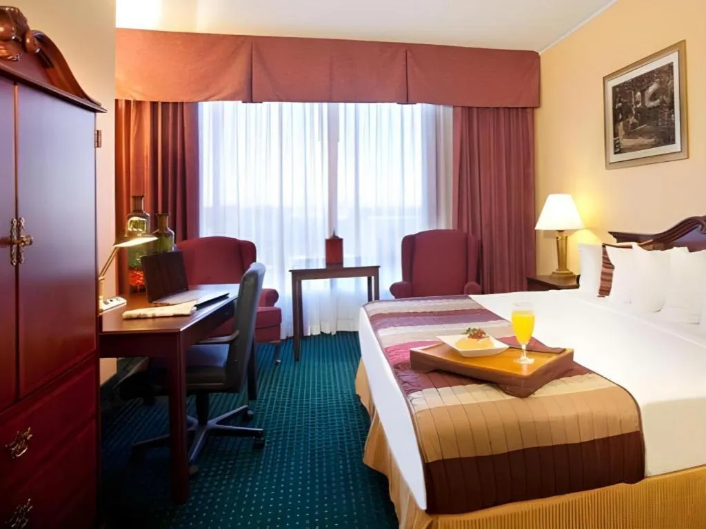 Bed in Magnuson Grand Conference Hotel