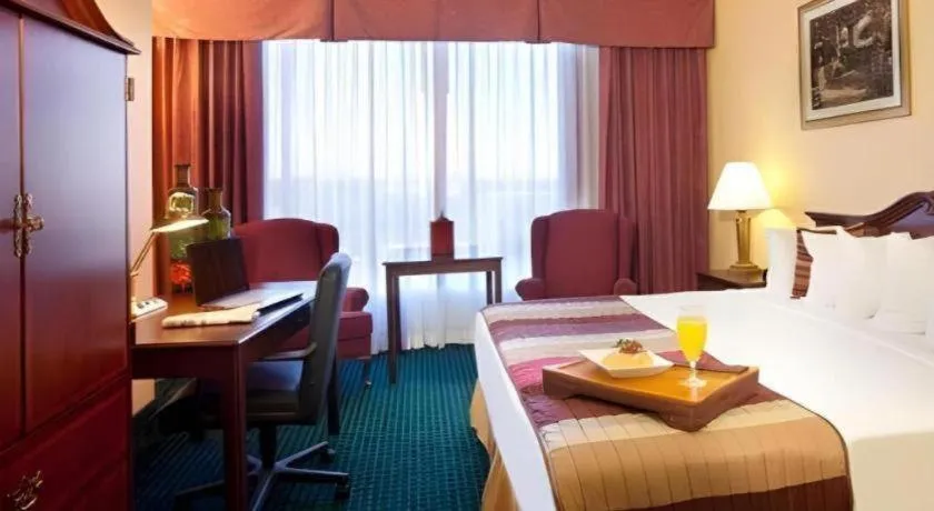 Bed in Magnuson Grand Conference Hotel