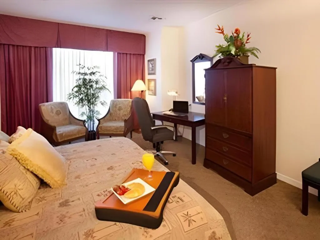 Bed in Magnuson Grand Conference Hotel